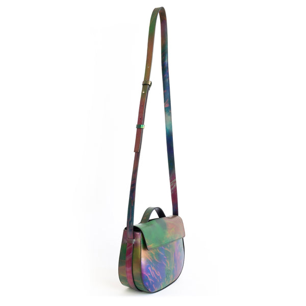 Printed iridescent vegan leather crossbody bag by Sydney Brown. Timeless, classic and modern.  Angle front crossbody, shoulder strap.