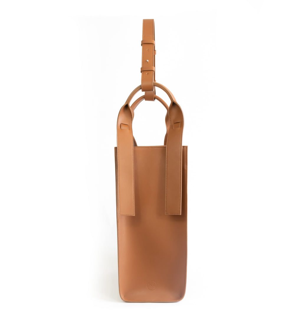 Brown eco vegan leather tote shoulder bag by Sydney Brown. Timeless, classic and modern. Side view.